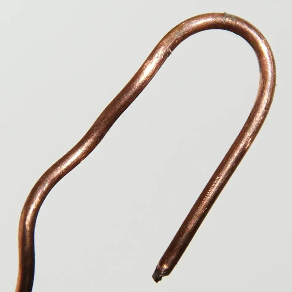 Short piece of bright bare copper wire