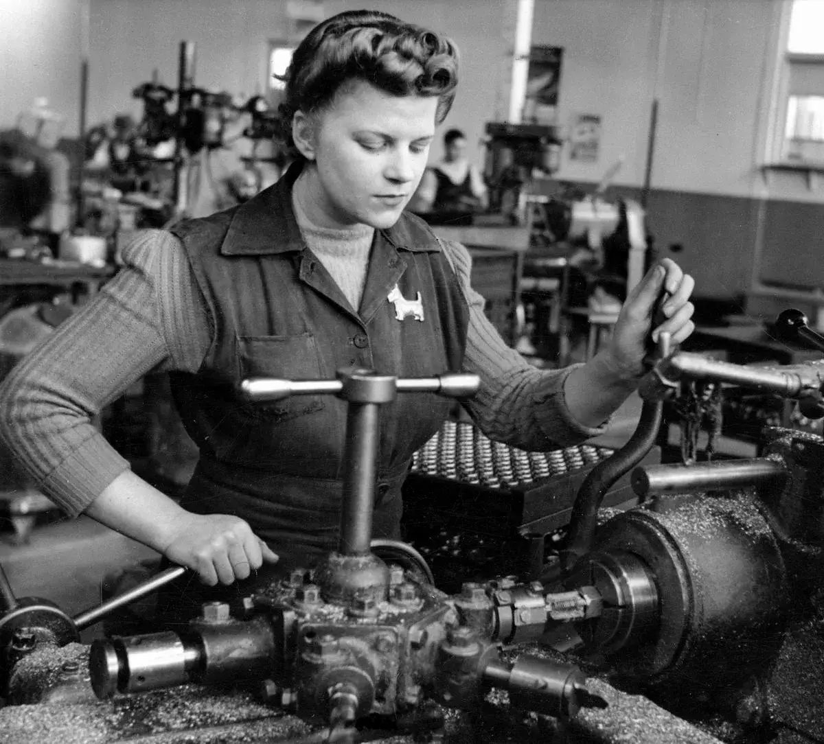 Historic photo of brass fittings being machined on a lathe
