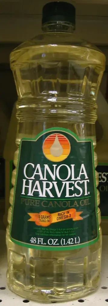 A bottle of Canola Harvest canola oil photographed against a white background