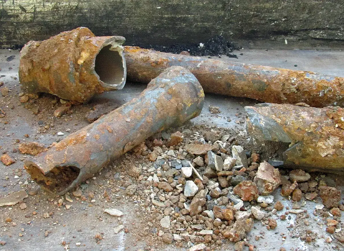Broken, rusted cast iron water pipes