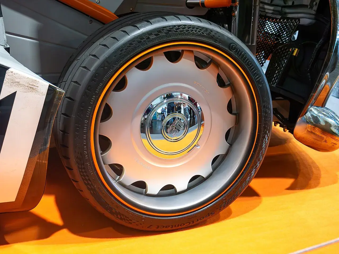 Continental SportContact 7 tyre on a show car wheel — brand and model name legible on the sidewall