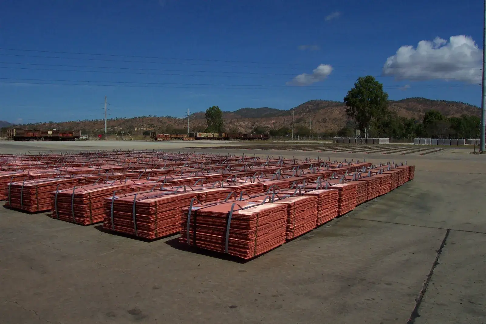 Strapped bundles of copper cathode plates stored outdoors