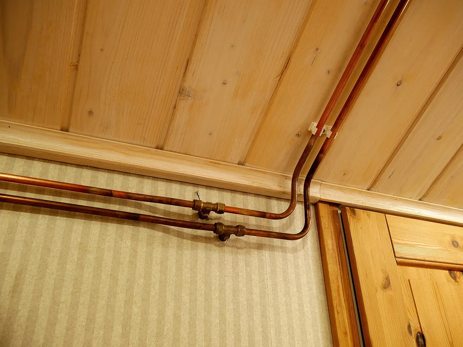 Copper water pipes on a wall