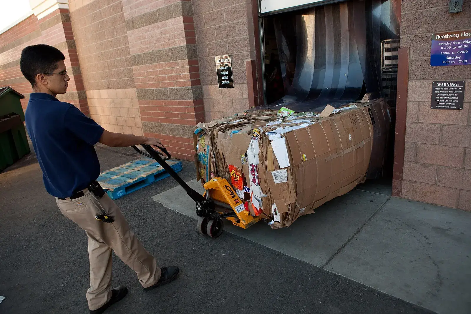 Bale of supermarket corrugated boxes being moved on a pallet truck
