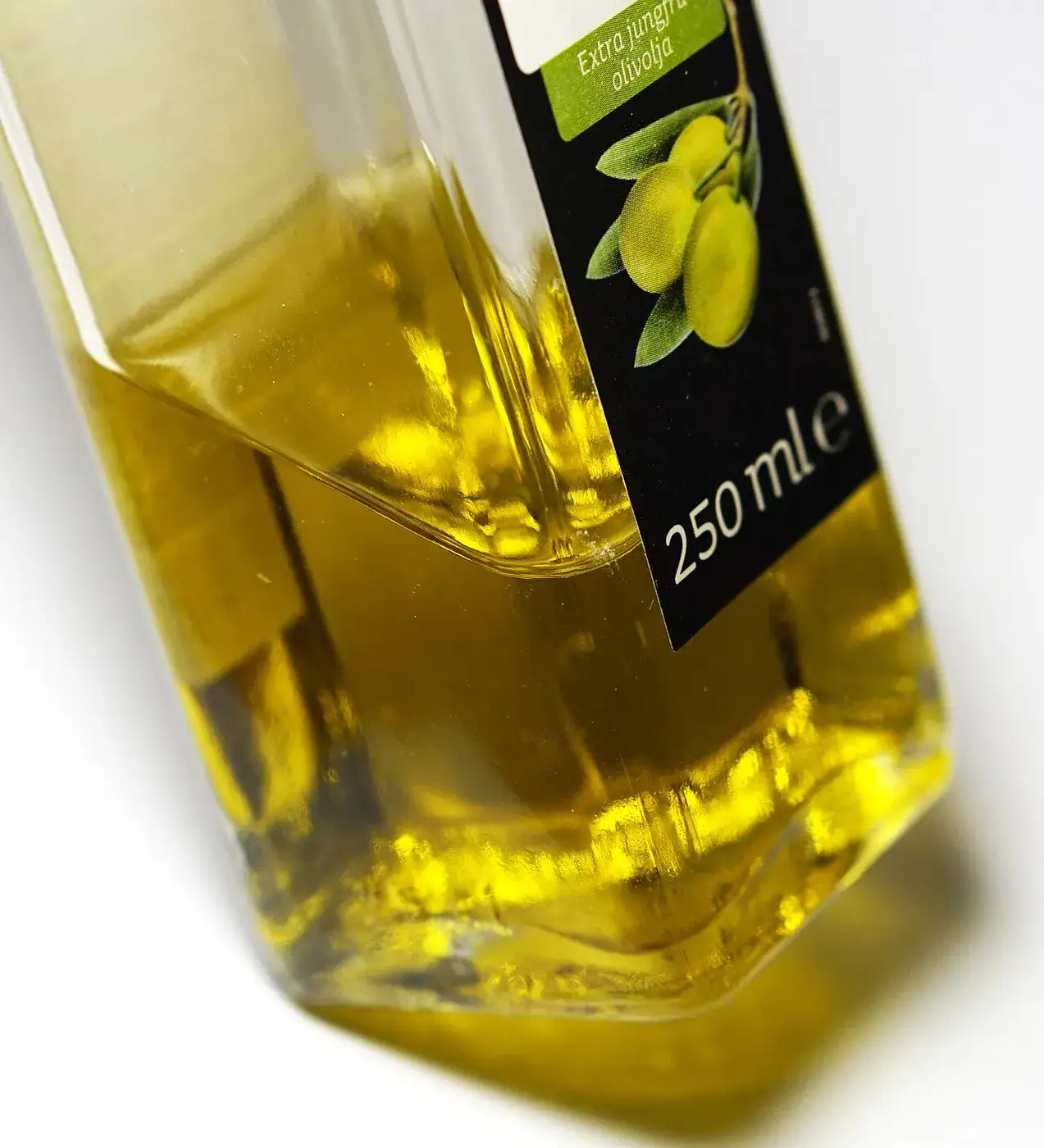 A 250 ml bottle of olive oil, the measure marked on the glass