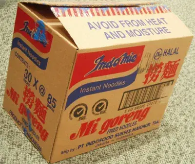An Indomie Mi Goreng export carton printed “30 x @ 85” with the Halal mark and the Indofood manufacturer line