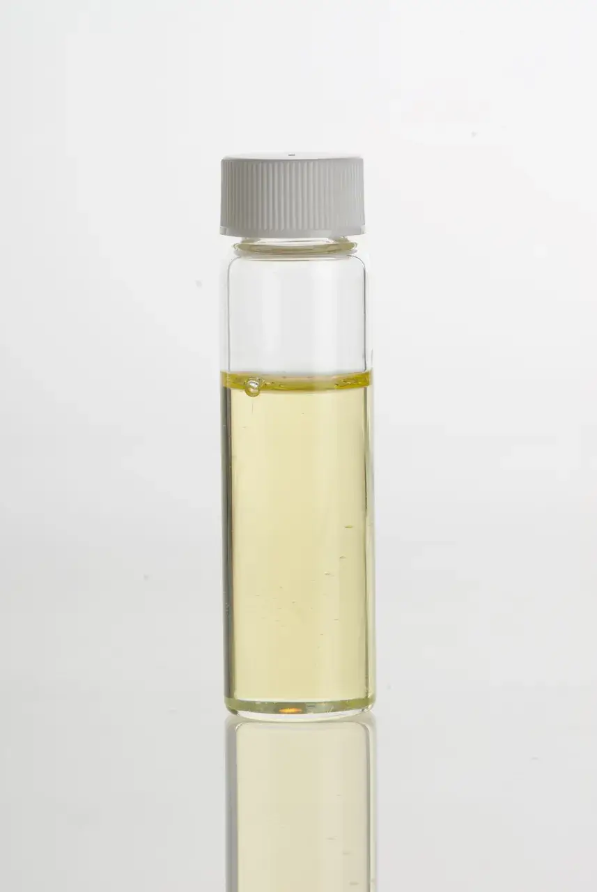 A vial of light sesame oil pressed from unroasted seed, pale gold in colour