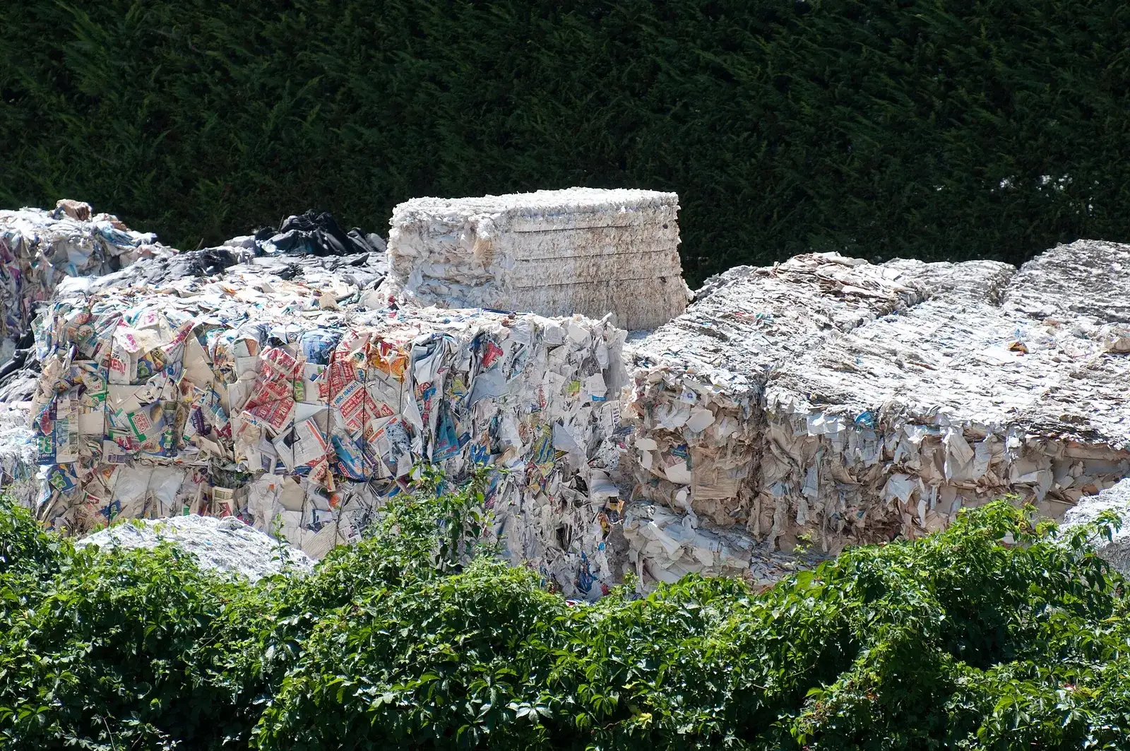 Bales of mixed waste paper stored outdoors