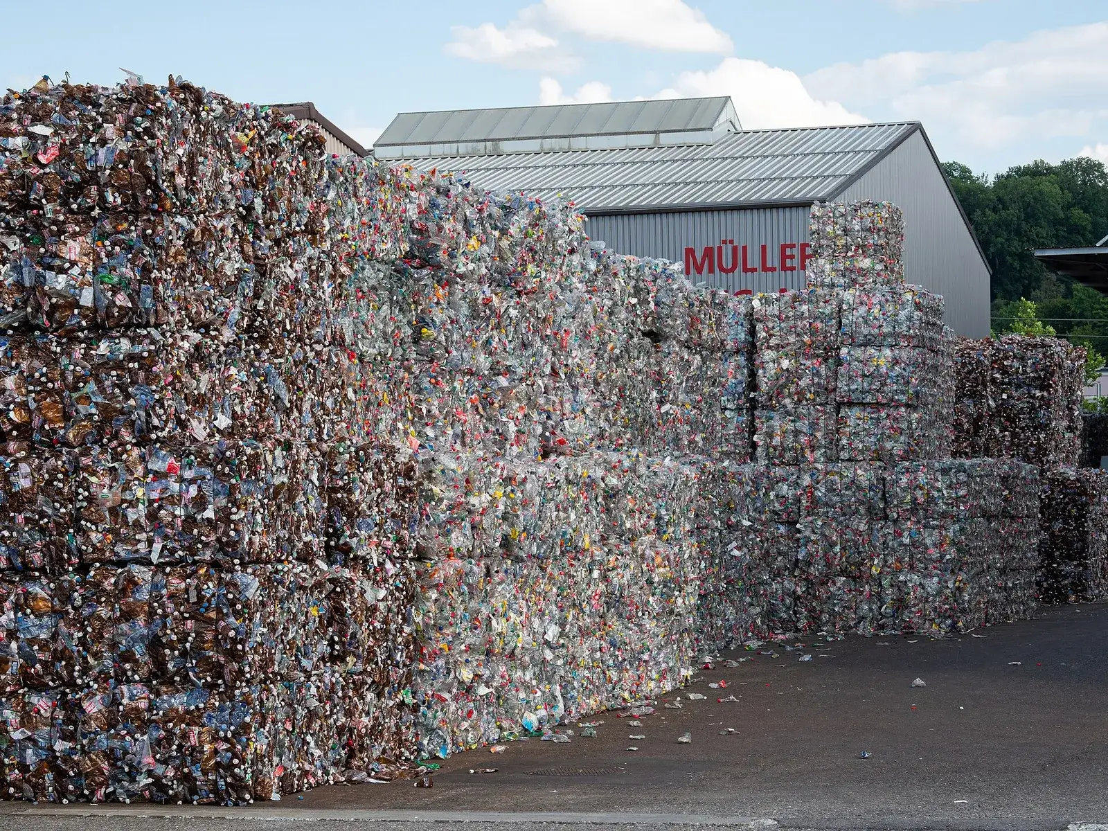 Yard of baled PET bottles at a recycling facility