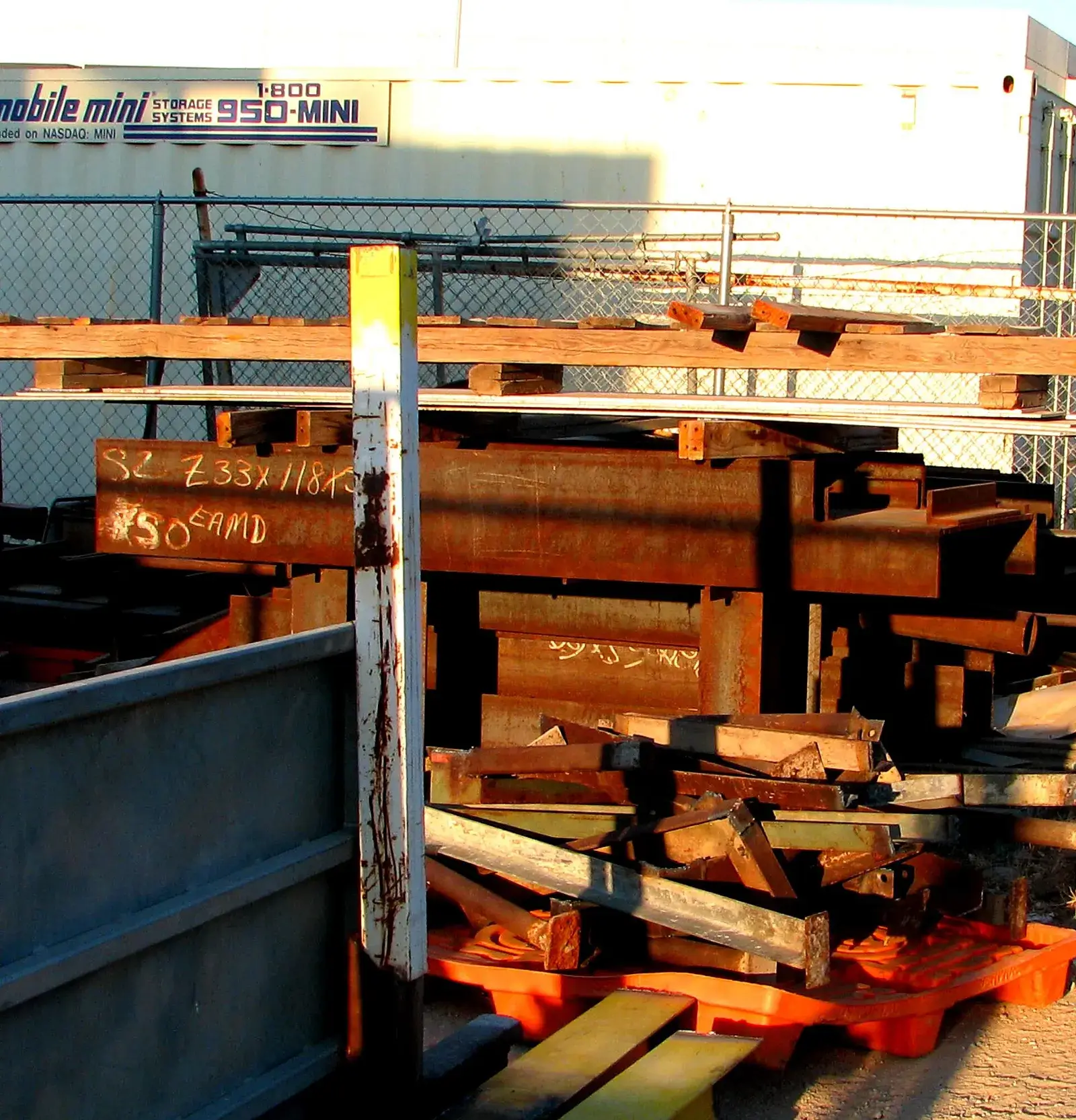 Heavy cut steel plate and structural offcuts in a scrap container