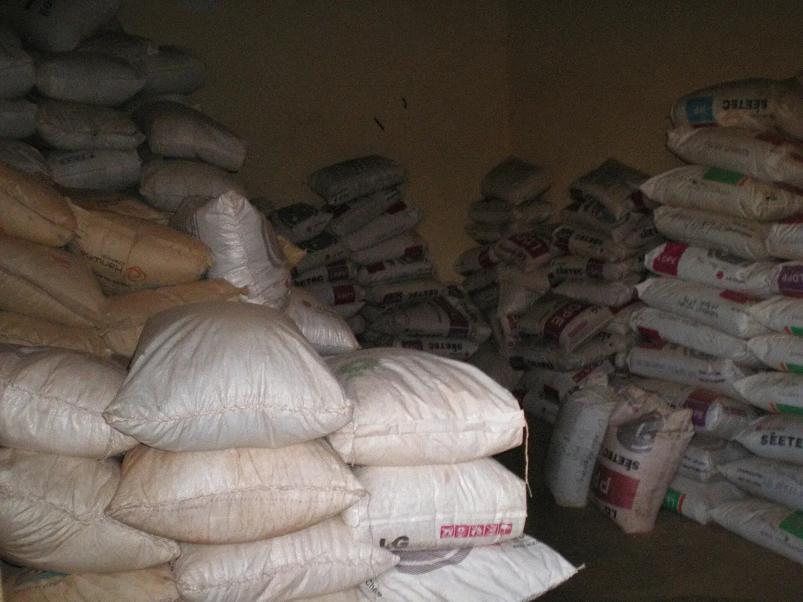 Sacks of recycled plastic granulate in a warehouse