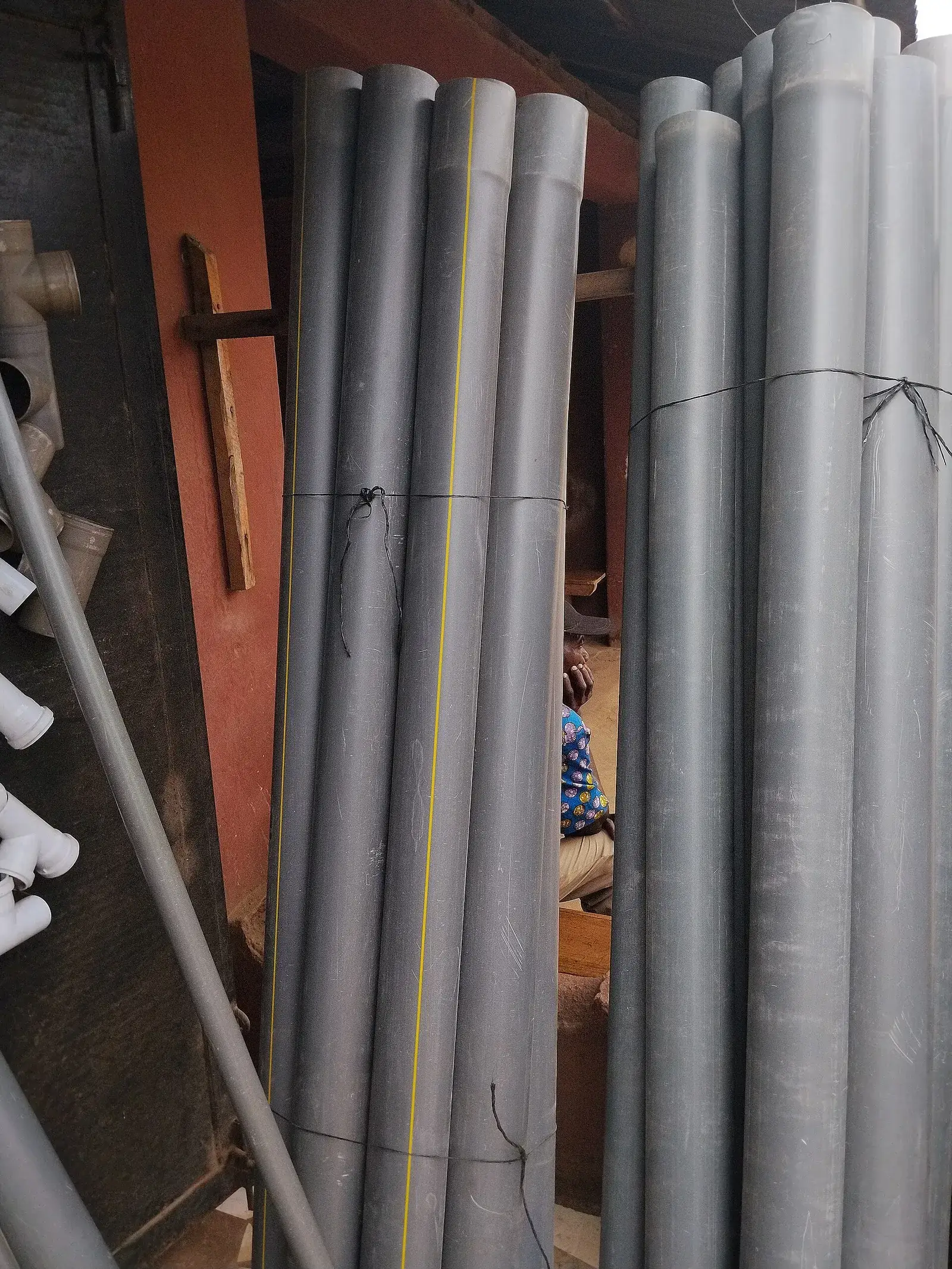 Bundled grey PVC drainage pipes