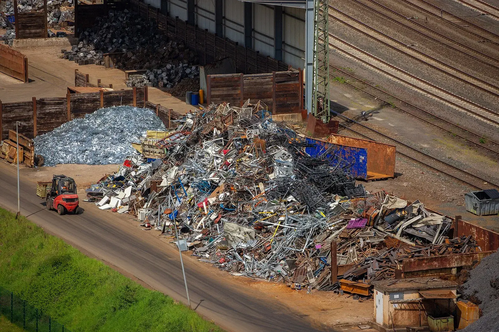 Aerial view of a scrap yard with ferrous scrap piles
