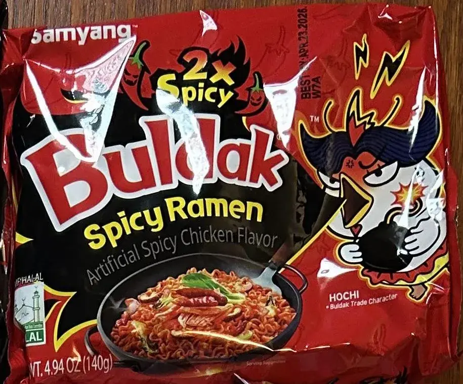 Front of a Samyang Buldak 2x Spicy Ramen pack, net weight 4.94 oz (140 g)
