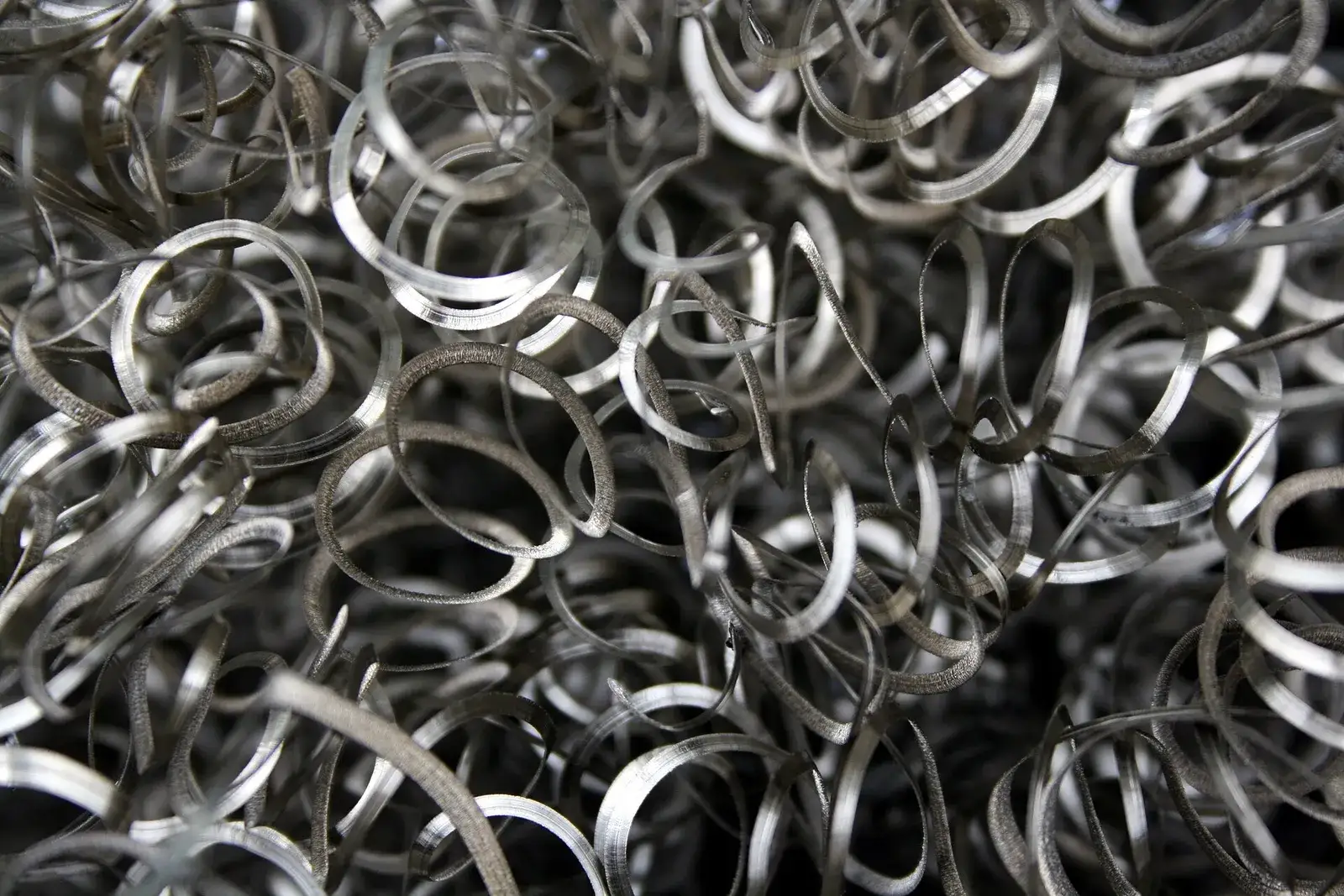 Close-up of curled steel turnings from a CNC lathe
