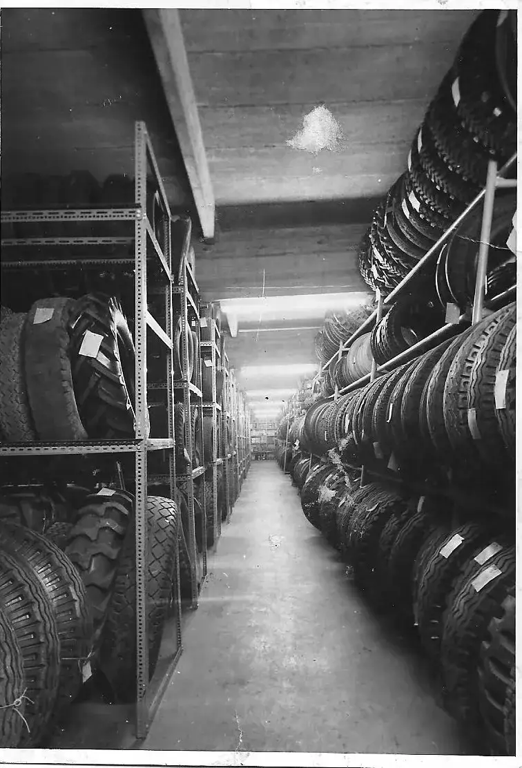 Aisle of a tyre warehouse with tyres stored on shelves