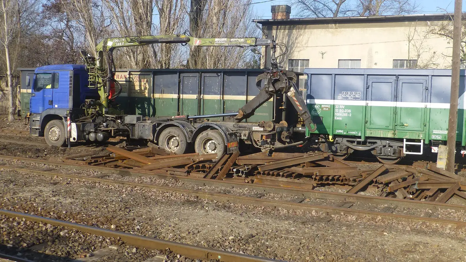 Broken rail scrap being loaded into a railway wagon