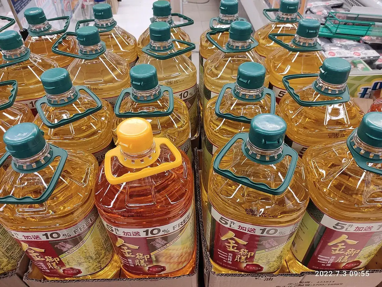 Five-litre bottles of refined vegetable oil stacked on pallets