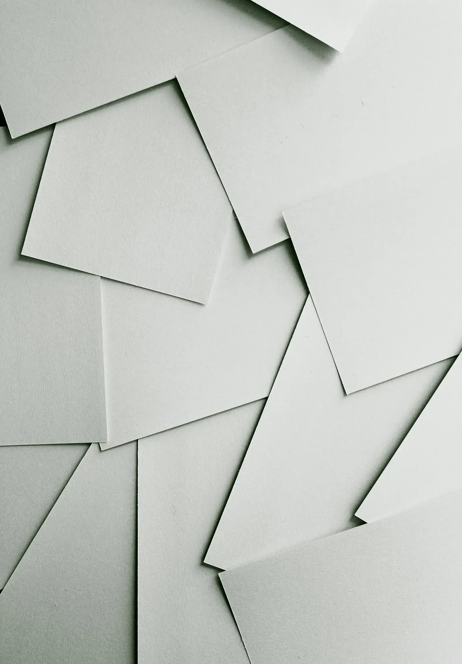 Scattered sheets of white paper
