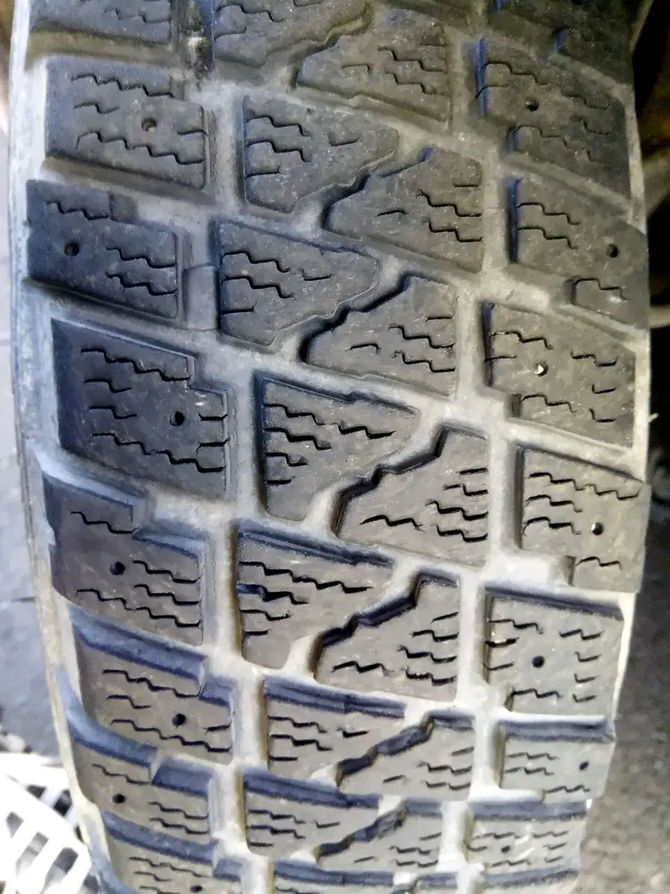 Winter tyre tread prepared for studs